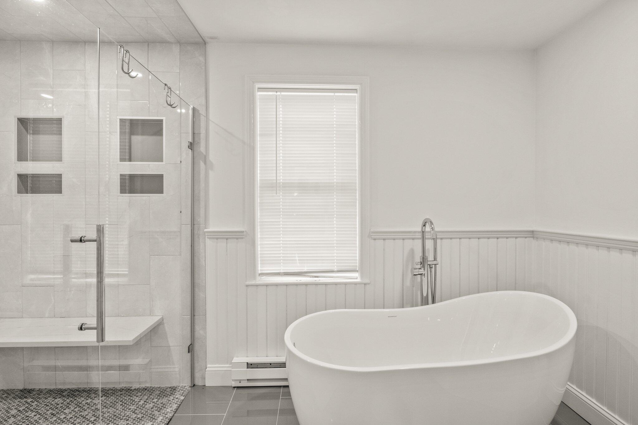 9 Deacons Path Sandwich, MA 02563 - Photo 15 of 41 a white bath tub sitting next to a shower