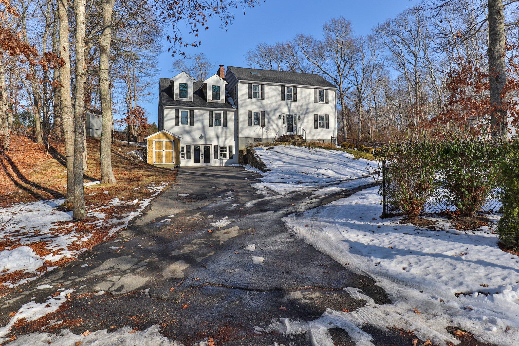 9 Deacons Path Sandwich, MA 02563 - Photo 2 of 41 a front view of a house with a yard