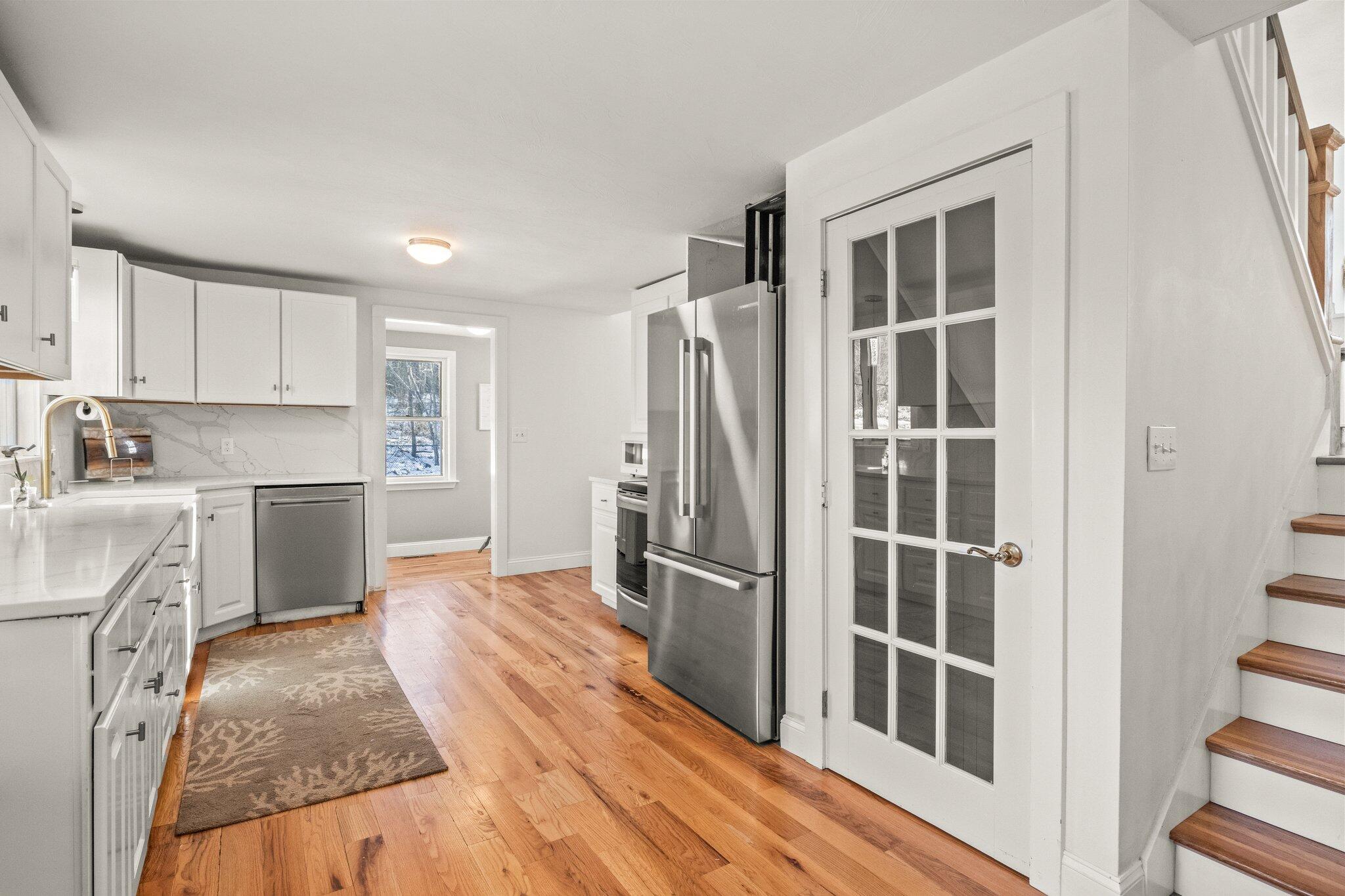 9 Deacons Path Sandwich, MA 02563 - Photo 22 of 41 a kitchen with granite countertop a refrigerator stove and sink