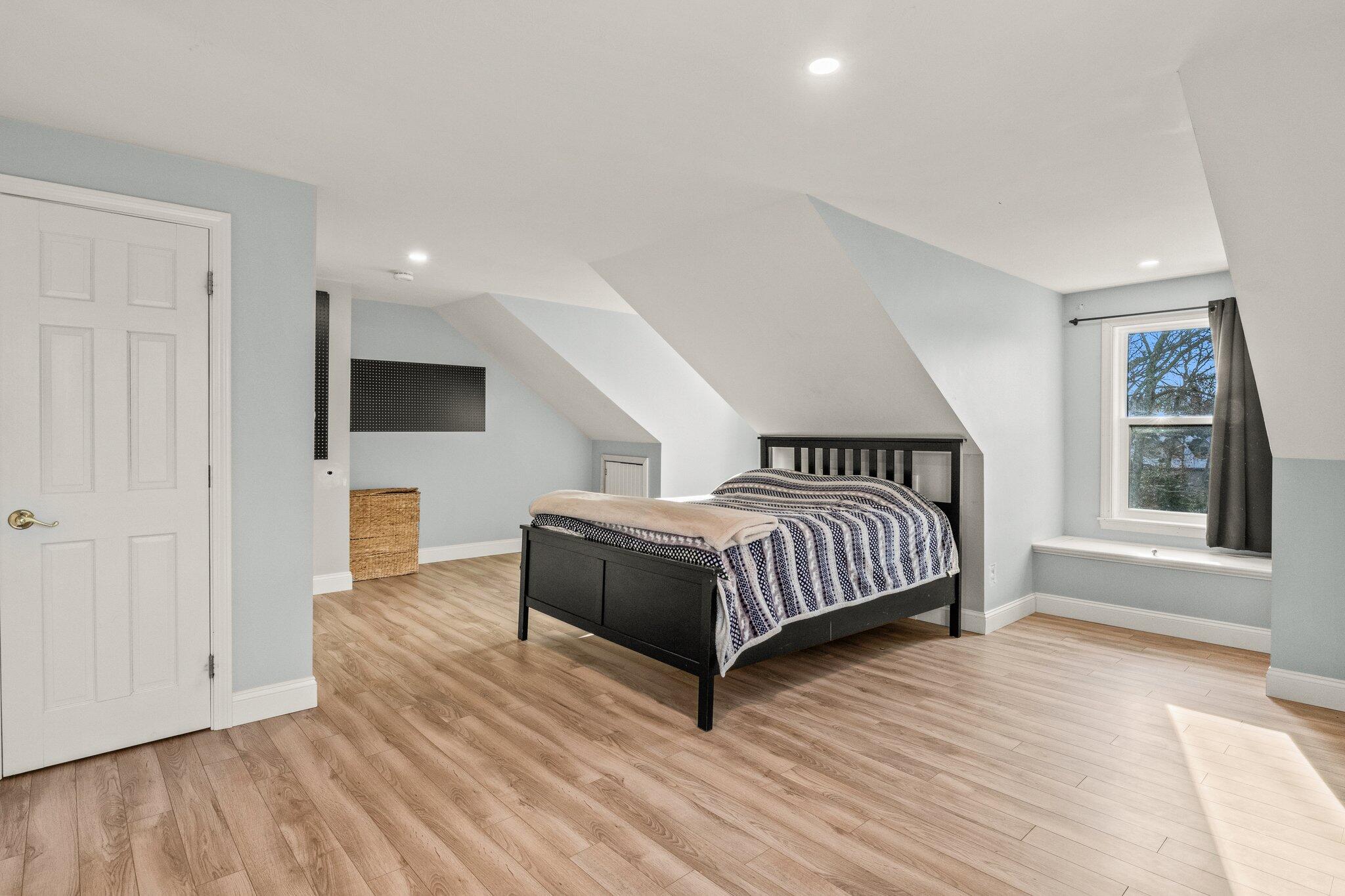 9 Deacons Path Sandwich, MA 02563 - Photo 24 of 41 a bedroom with a bed and a flat screen tv