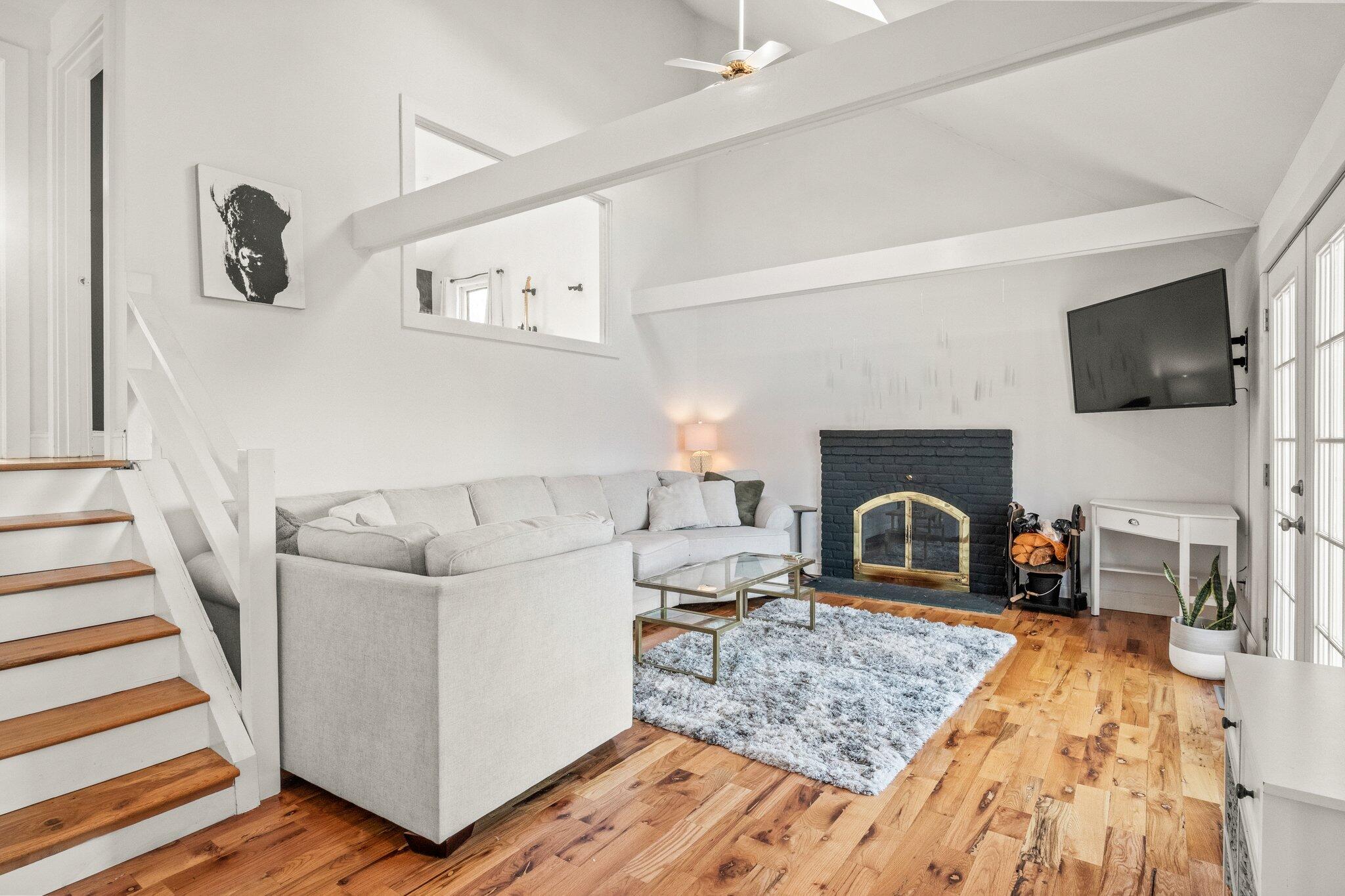 9 Deacons Path Sandwich, MA 02563 - Photo 30 of 41 a living room with furniture and a fireplace