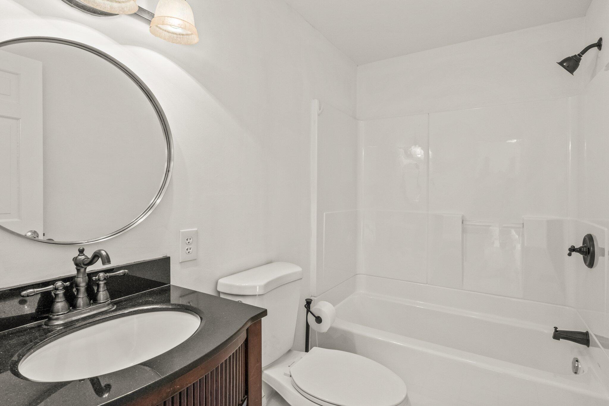 9 Deacons Path Sandwich, MA 02563 - Photo 6 of 41 a bathroom with a sink a toilet and a mirror