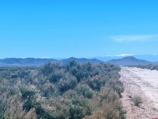 a view of mountains and valleys