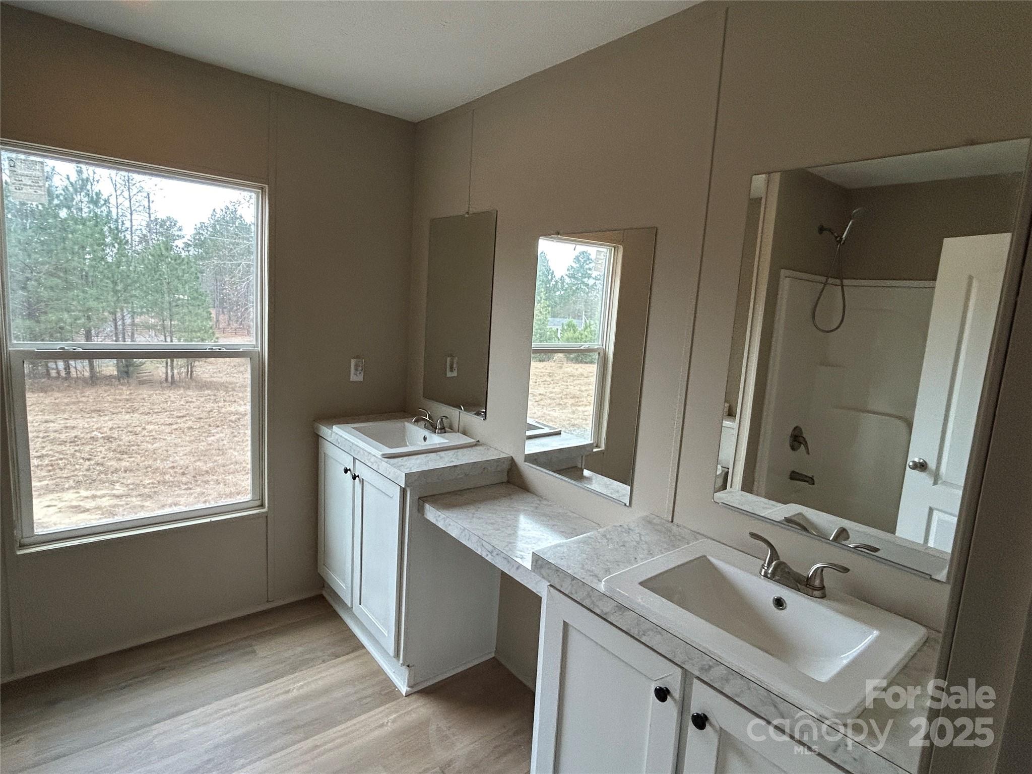 4765 Logging Road Lancaster, SC 29720 - Photo 13 of 19 a bathroom with a sink double vanity and a mirror