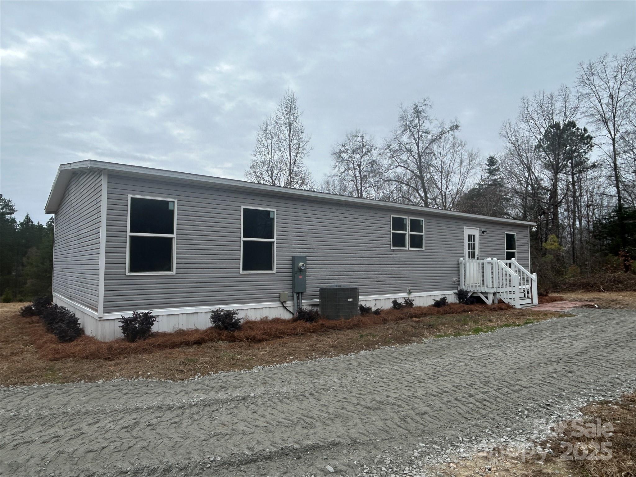 4765 Logging Road Lancaster, SC 29720 - Photo 18 of 19 a backyard of a house with barbeque oven table and chairs