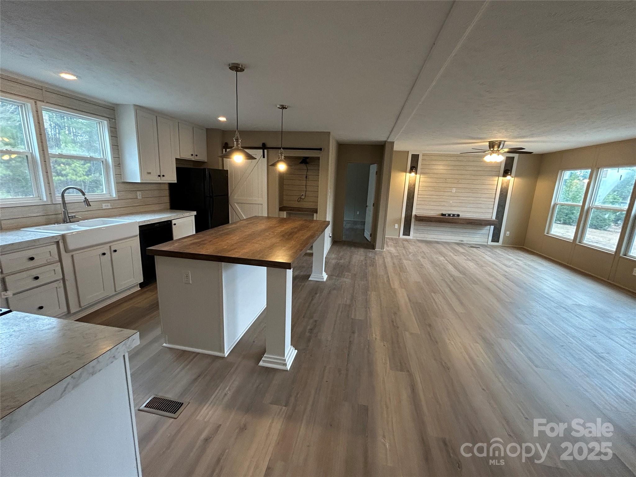 4765 Logging Road Lancaster, SC 29720 - Photo 6 of 19 a kitchen with wooden floors and wide window
