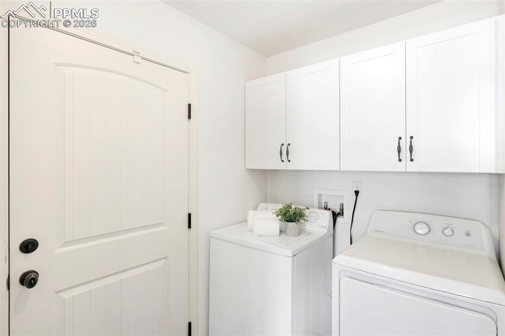 6528 Watusi Road Peyton, CO 80831 - Photo 12 of 27 a utility room with dryer and washer