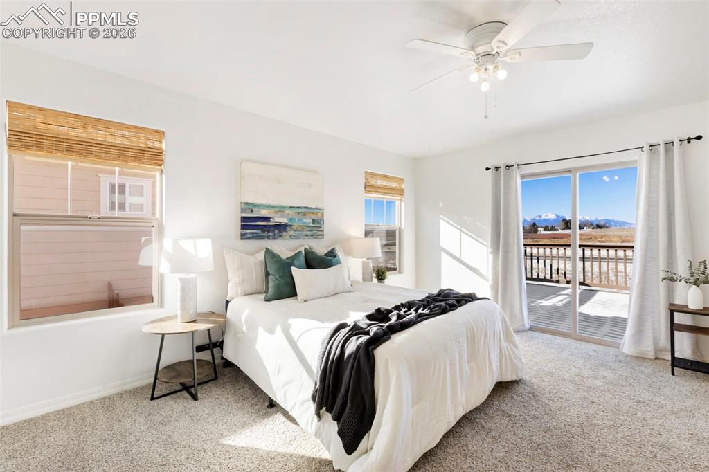 6528 Watusi Road Peyton, CO 80831 - Photo 13 of 27 a bedroom with a bed and a window