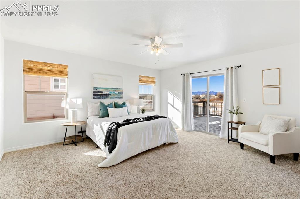 6528 Watusi Road Peyton, CO 80831 - Photo 14 of 27 a bed room with furniture and a window