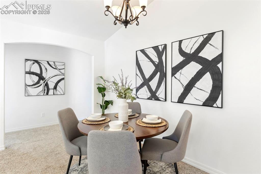 6528 Watusi Road Peyton, CO 80831 - Photo 9 of 27 a view of a dining room with furniture window and wooden floor