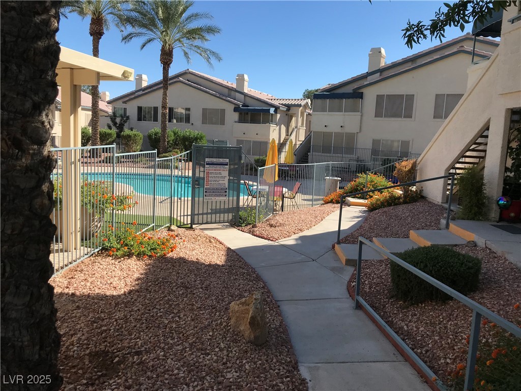 3425 East Russell Road, Unit 170 Las Vegas, NV 89120 - Photo 5 of 13 Community pool featuring stairway and a residential view