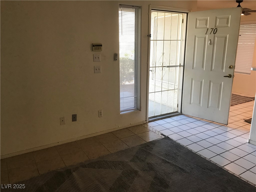 3425 East Russell Road, Unit 170 Las Vegas, NV 89120 - Photo 10 of 13 Doorway with tile patterned floors and baseboards