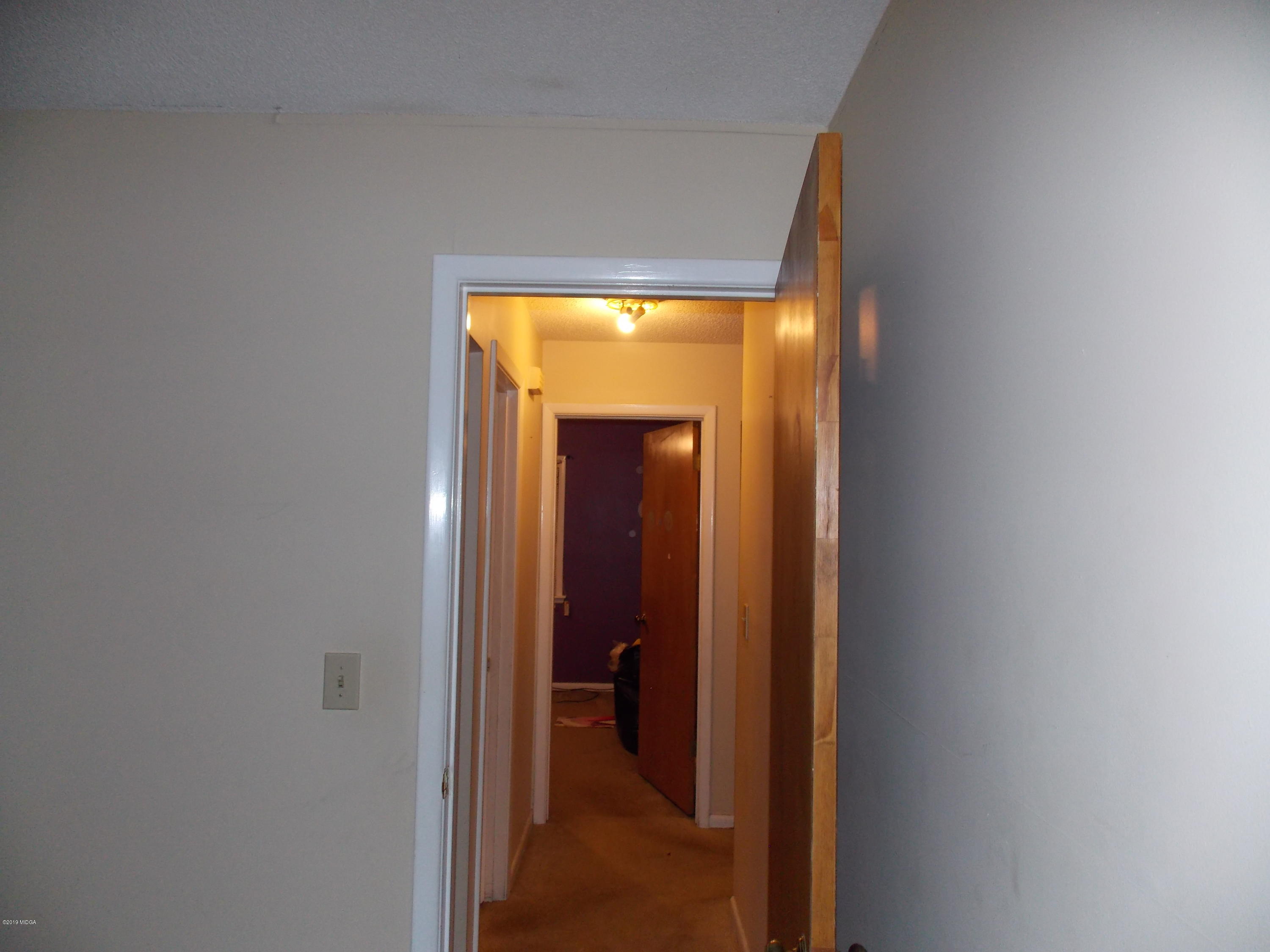 1159 Ridgeview Circle Macon, GA 31220 - Photo 12 of 12 a view of a hallway with wooden floor