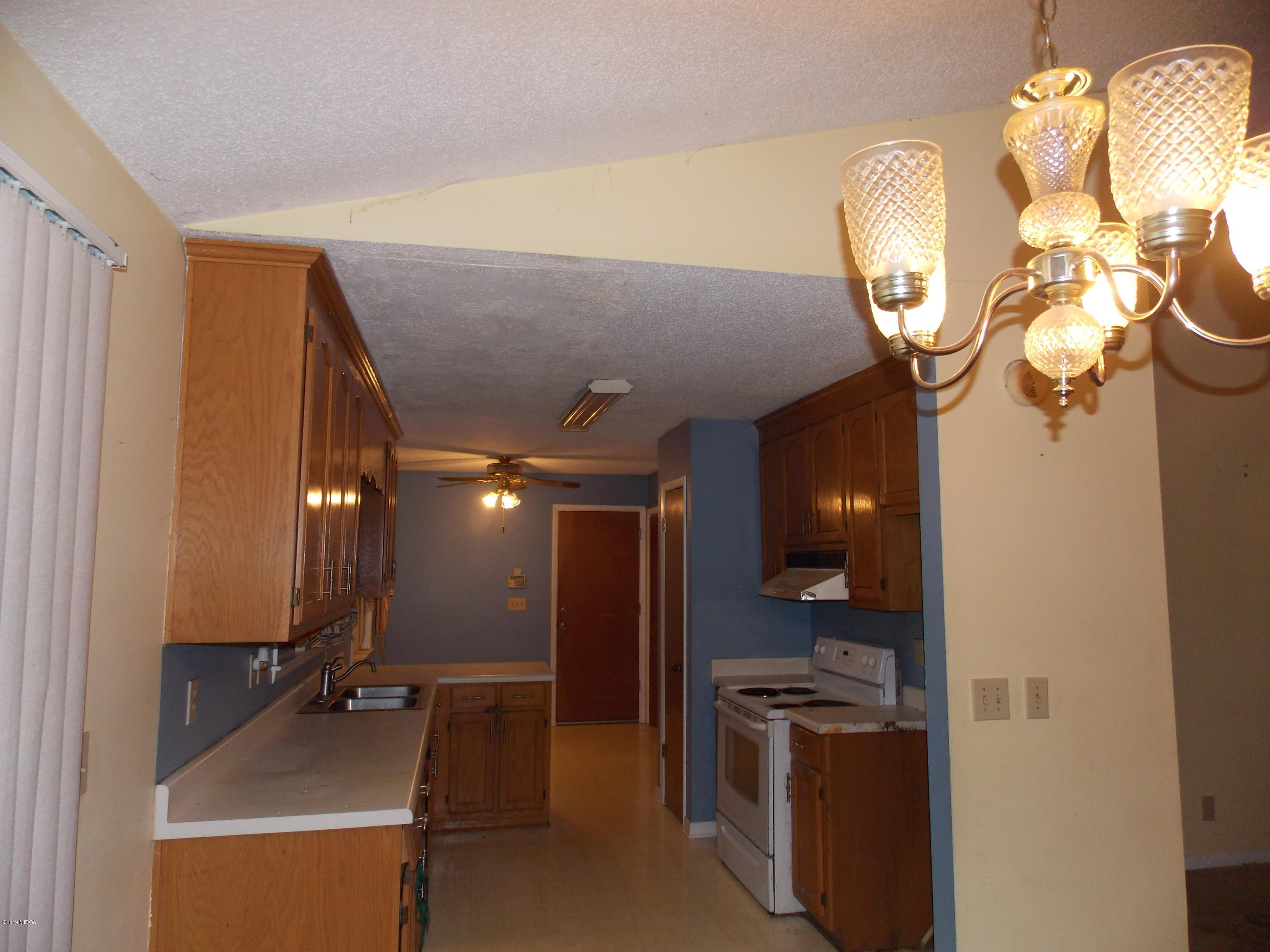 1159 Ridgeview Circle Macon, GA 31220 - Photo 6 of 12 a view of a kitchen with a sink and stainless steel appliances
