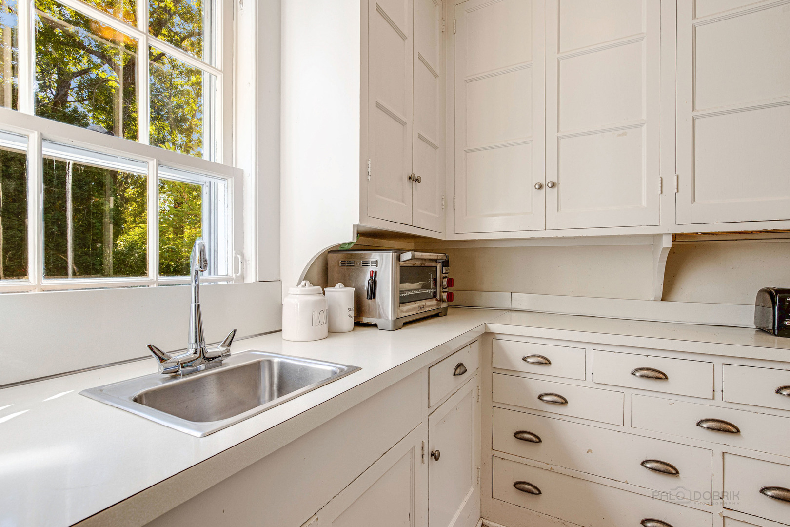 620 Spruce Street Winnetka, IL 60093 - Photo 13 of 26 a kitchen with cabinets appliances and a sink