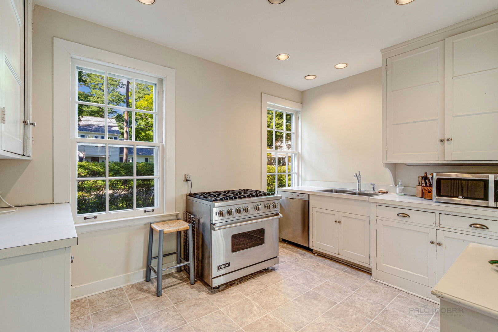 620 Spruce Street Winnetka, IL 60093 - Photo 14 of 26 a kitchen with a stove a sink and a window