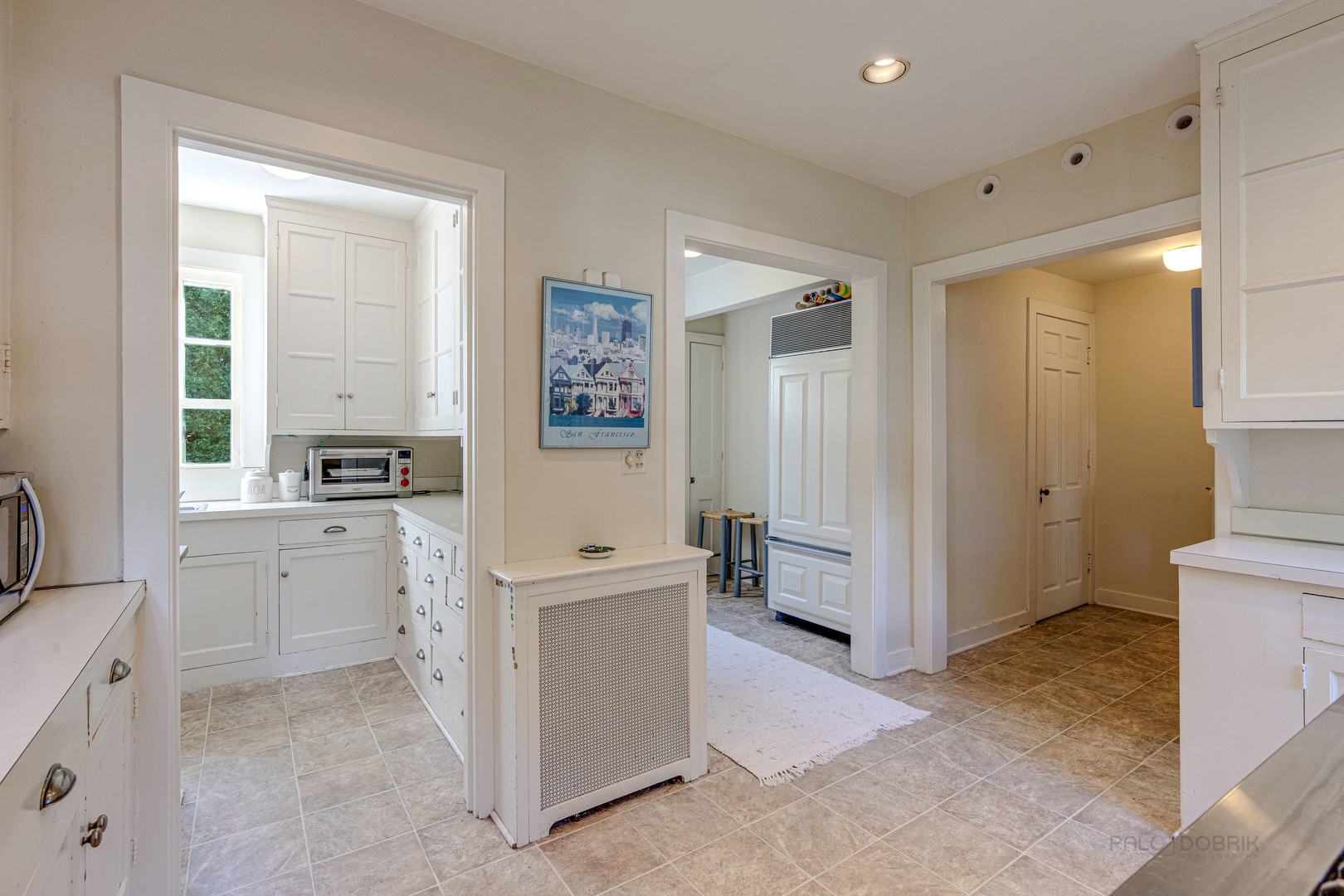620 Spruce Street Winnetka, IL 60093 - Photo 15 of 26 a view of a kitchen with white cabinets