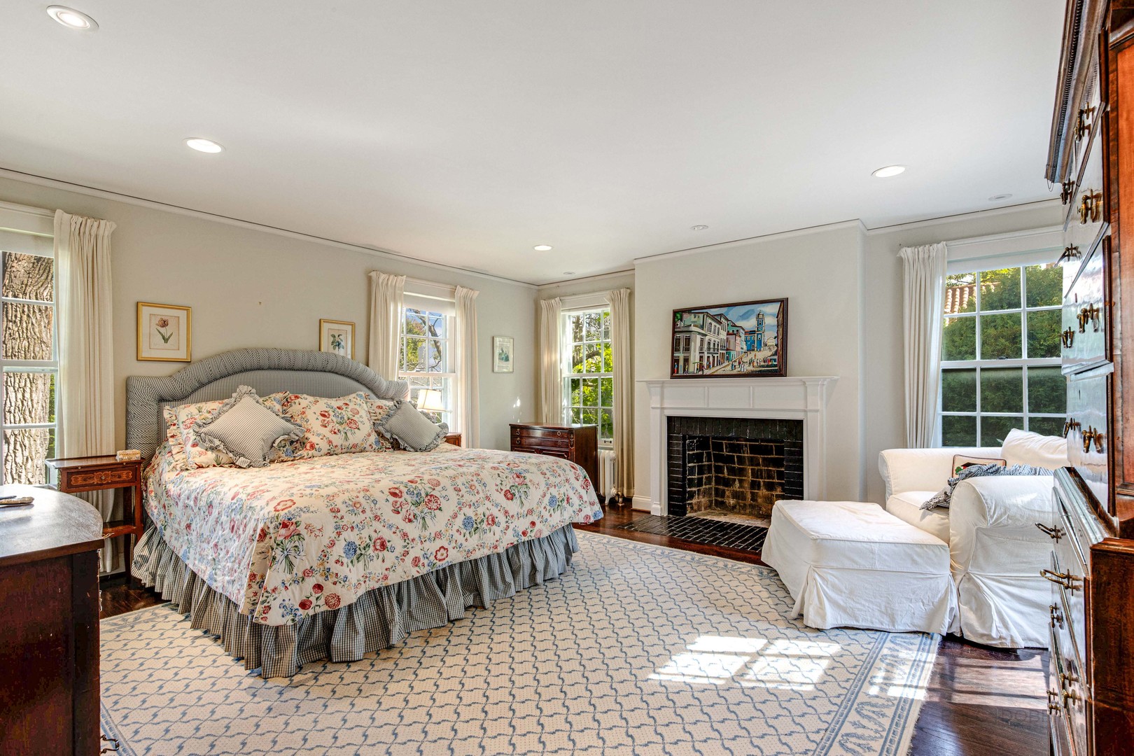 620 Spruce Street Winnetka, IL 60093 - Photo 16 of 26 a bedroom with a large bed and a fireplace