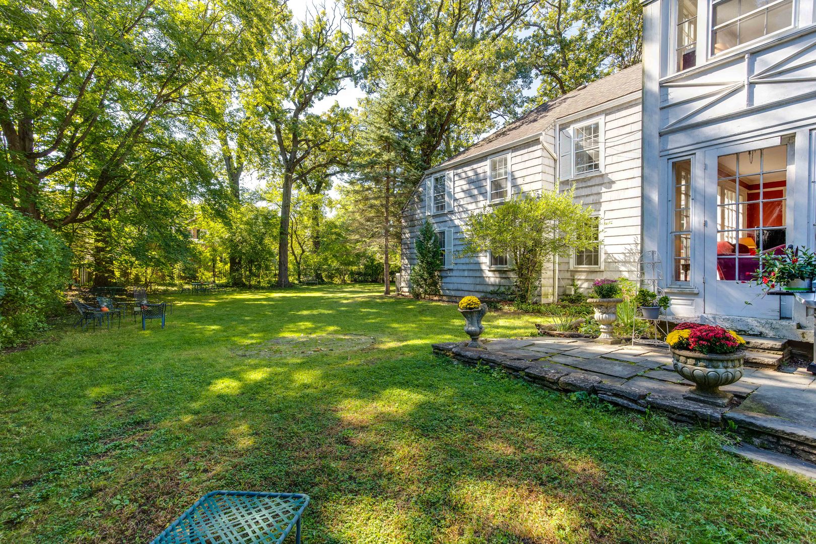 620 Spruce Street Winnetka, IL 60093 - Photo 22 of 26 a view of a house with backyard and sitting area
