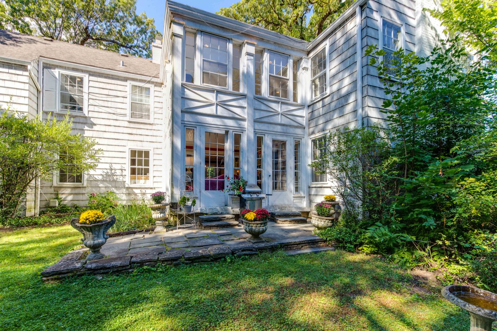 620 Spruce Street Winnetka, IL 60093 - Photo 23 of 26 a view of pool with outdoor seating and a garden