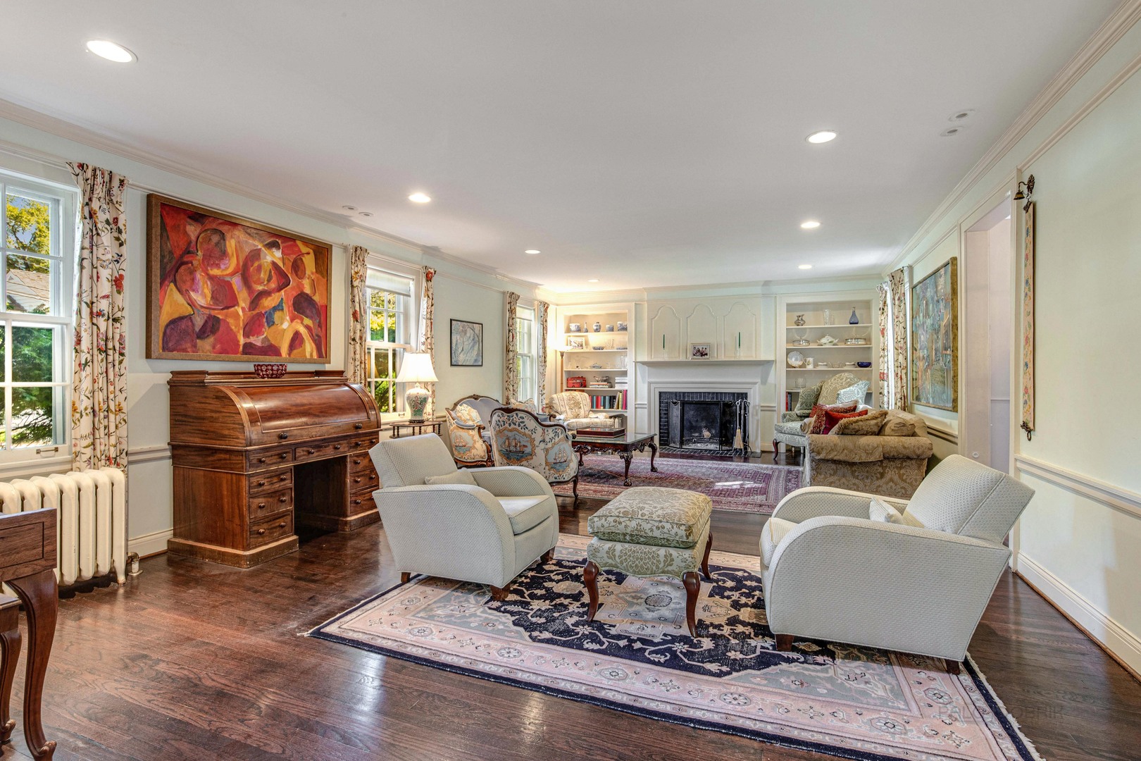 620 Spruce Street Winnetka, IL 60093 - Photo 4 of 26 a living room with furniture a fireplace and a flat screen tv