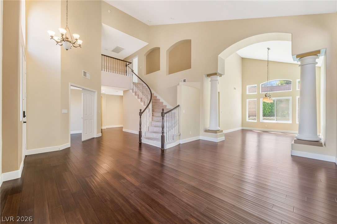 271 Pointe Ranier Avenue Henderson, NV 89012 - Photo 2 of 26 This grand foyer showcases soaring ceilings, an elegant staircase, and lustrous hardwood flooring.