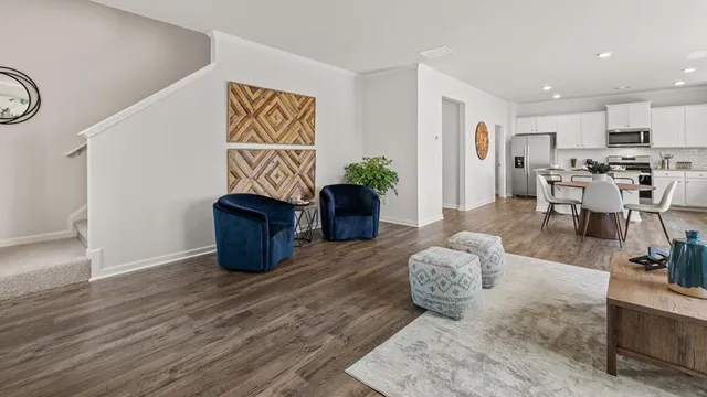 a living room with furniture and a table