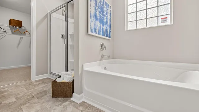 a spacious bathroom with bathtub