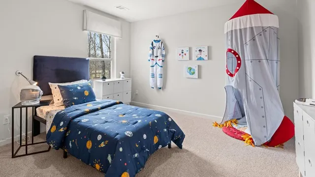 a bedroom with a bed and a couch