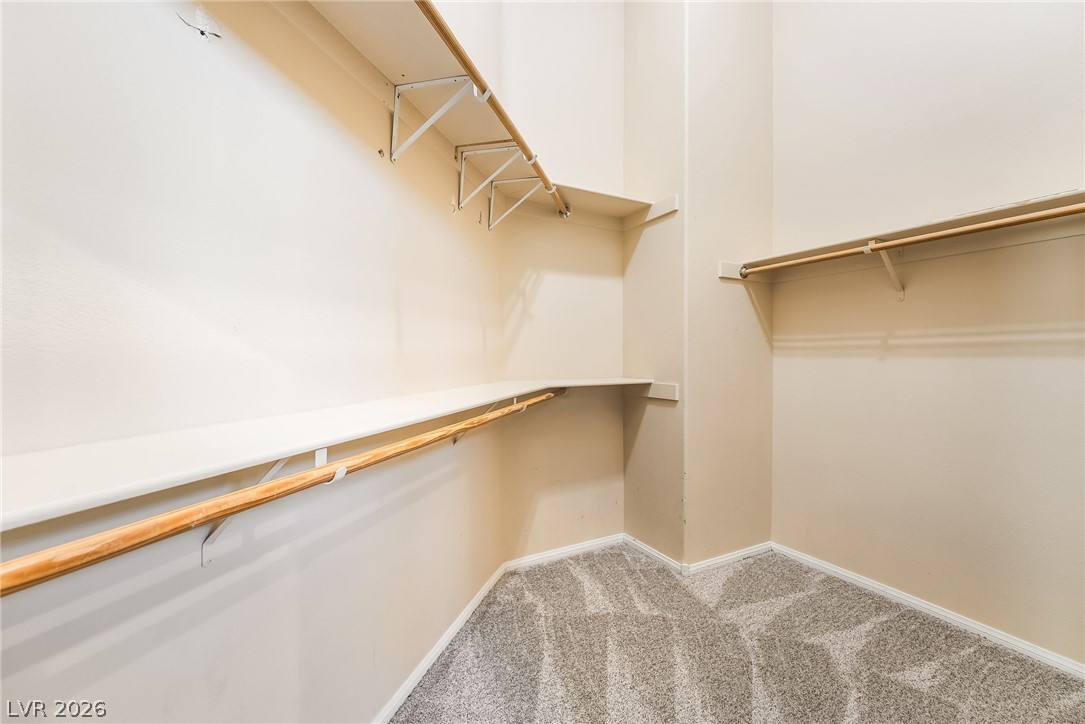 261 Timber Hollow Street Henderson, NV 89012 - Photo 35 of 51 Ample shelving and hanging space defines this functional walk-in closet.