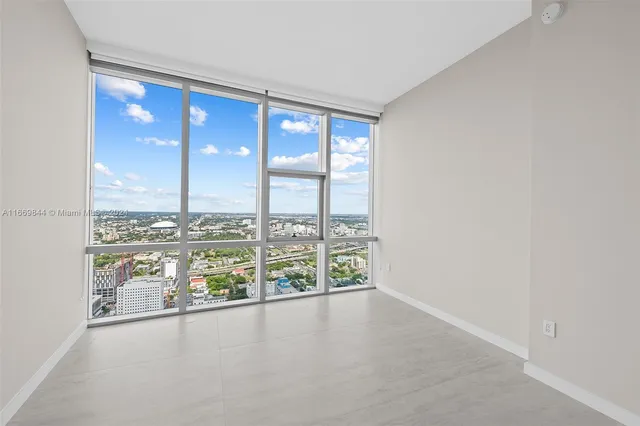 an aerial view of a house with a swimming pool