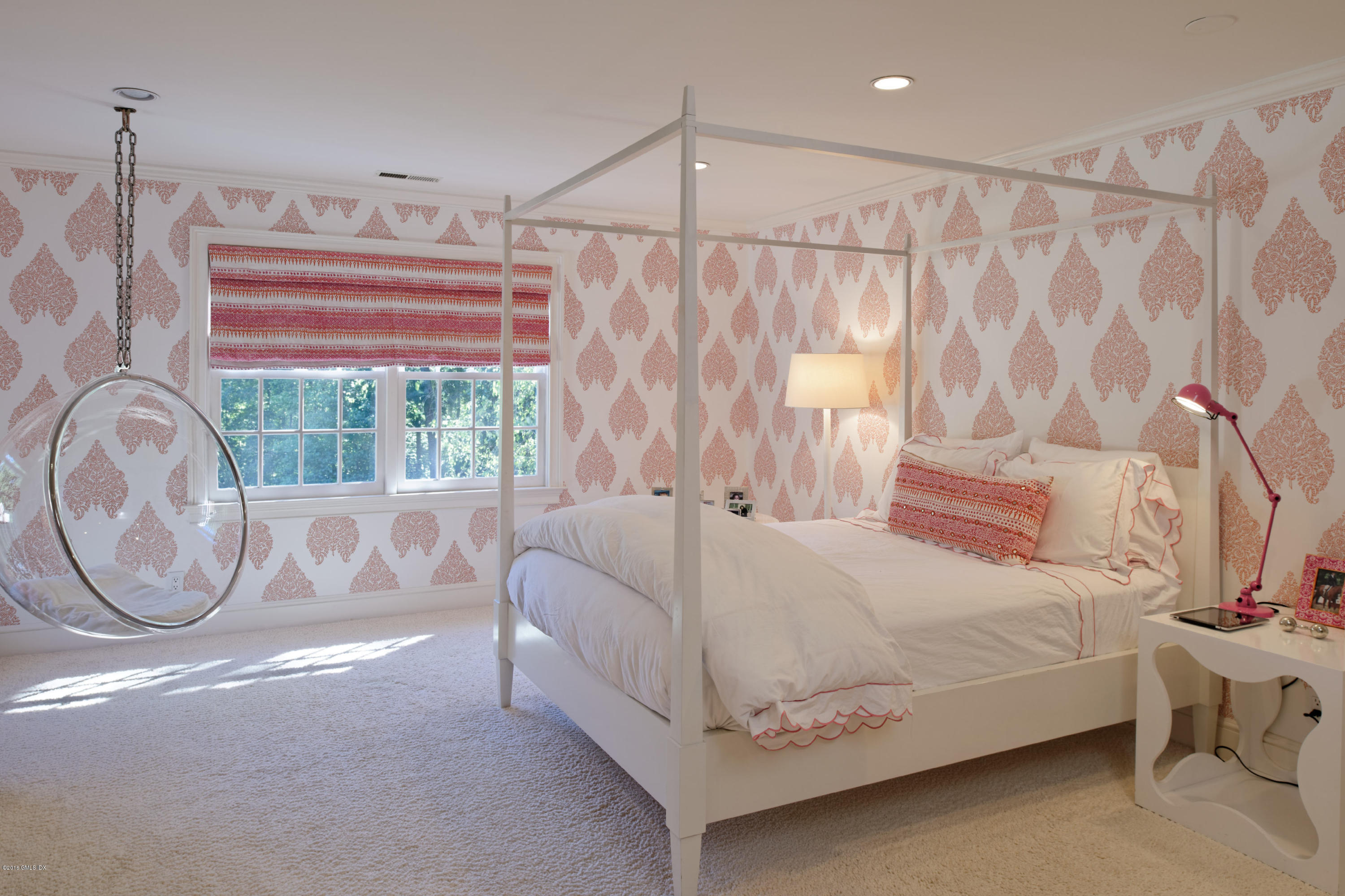46 Quail Road Greenwich, CT 06831 - Photo 12 of 22 a bedroom with a bed and a chandelier