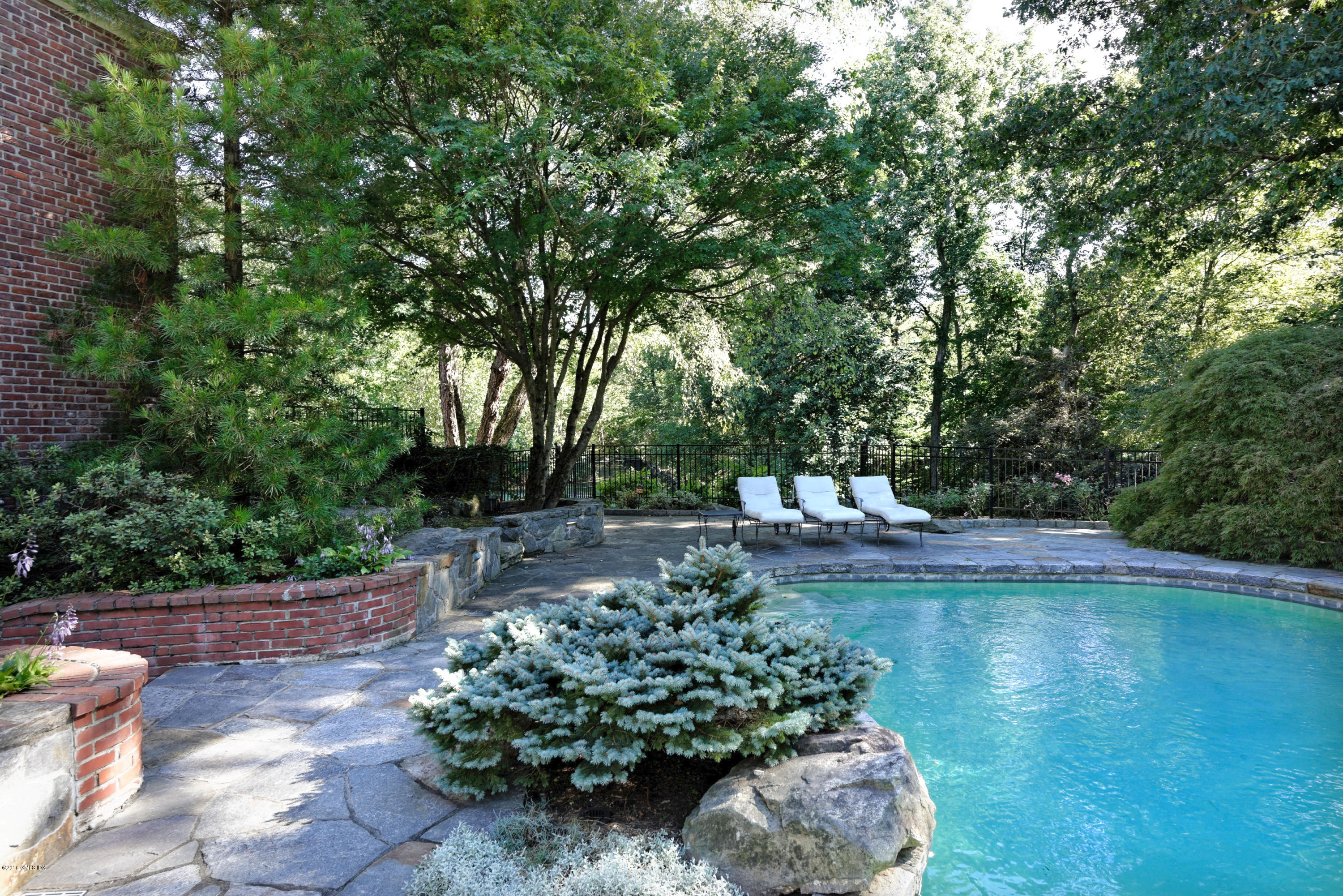 46 Quail Road Greenwich, CT 06831 - Photo 20 of 22 a view of a backyard with sitting area
