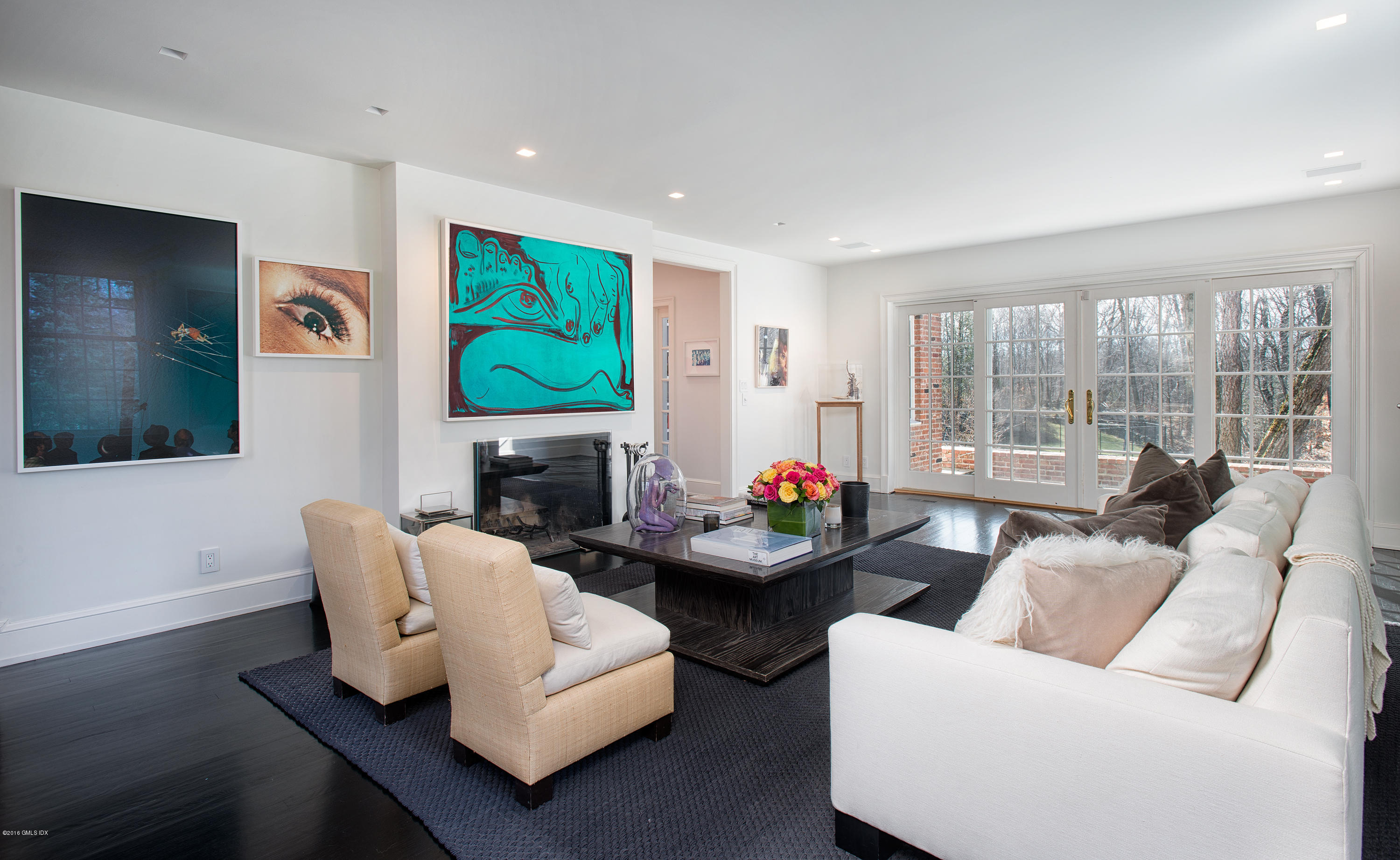 46 Quail Road Greenwich, CT 06831 - Photo 3 of 22 a living room with fireplace furniture and a flat screen tv