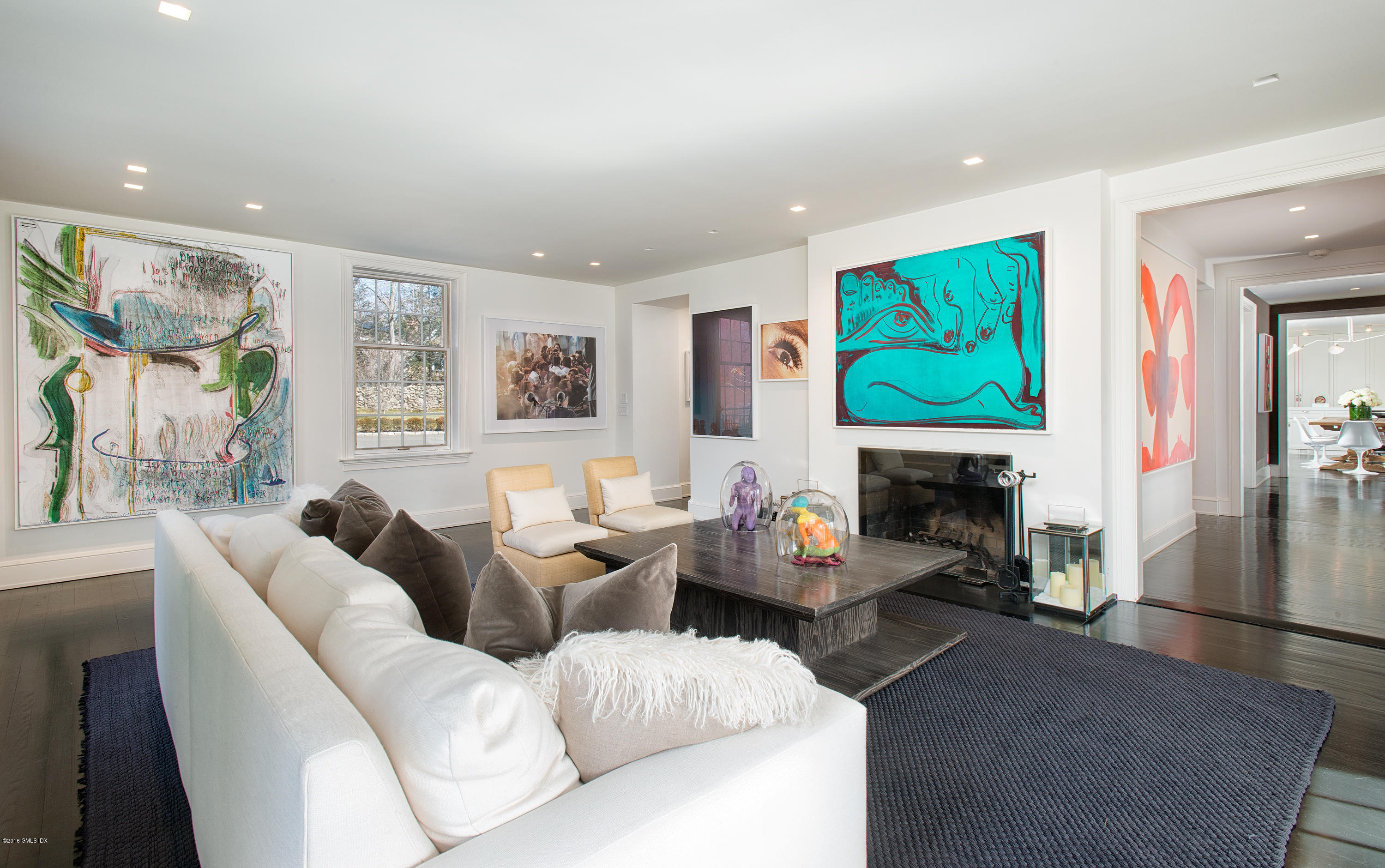 46 Quail Road Greenwich, CT 06831 - Photo 4 of 22 a living room with furniture a fireplace and a flat screen tv