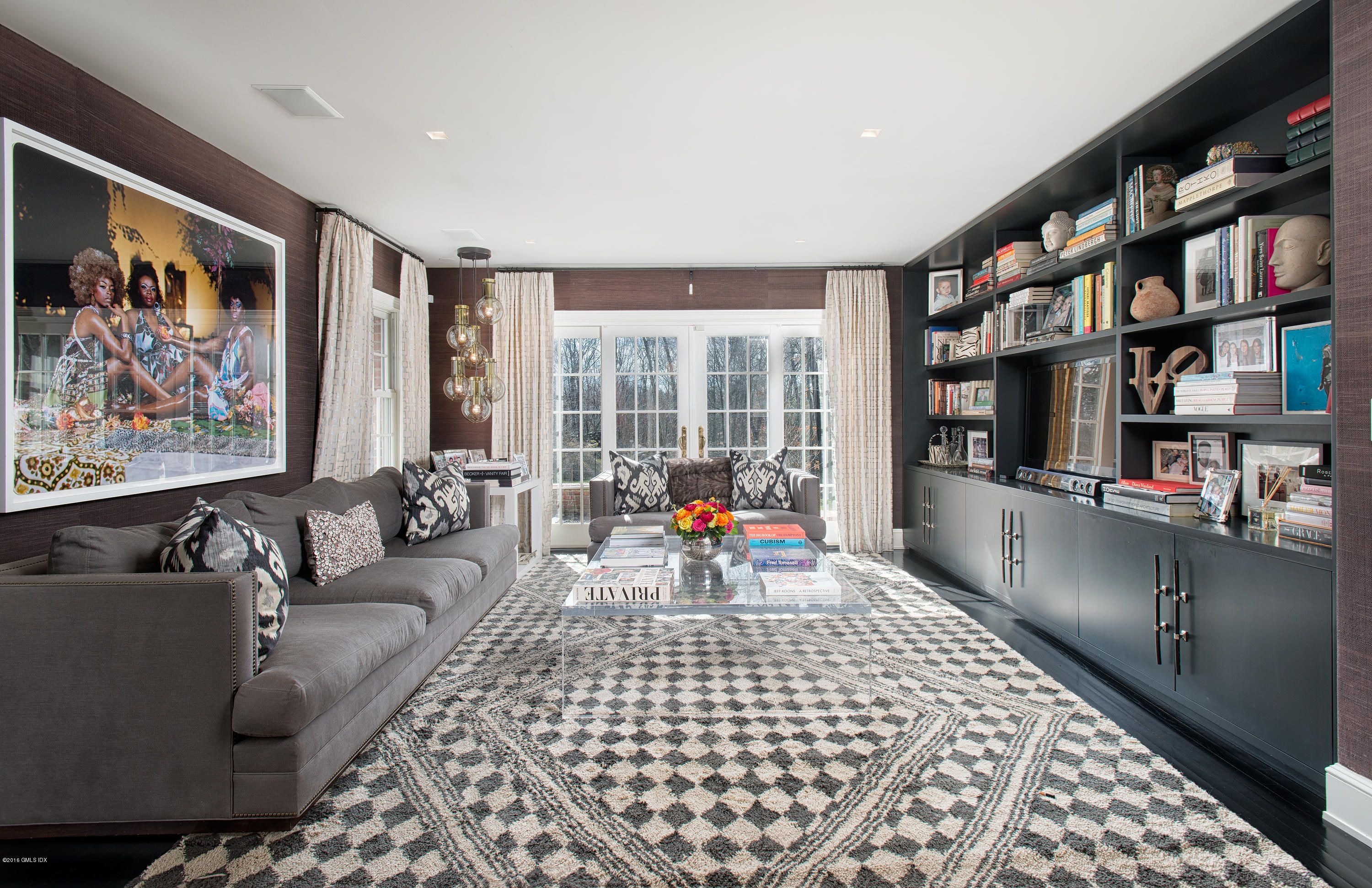 46 Quail Road Greenwich, CT 06831 - Photo 6 of 22 a living room with furniture and a book shelf