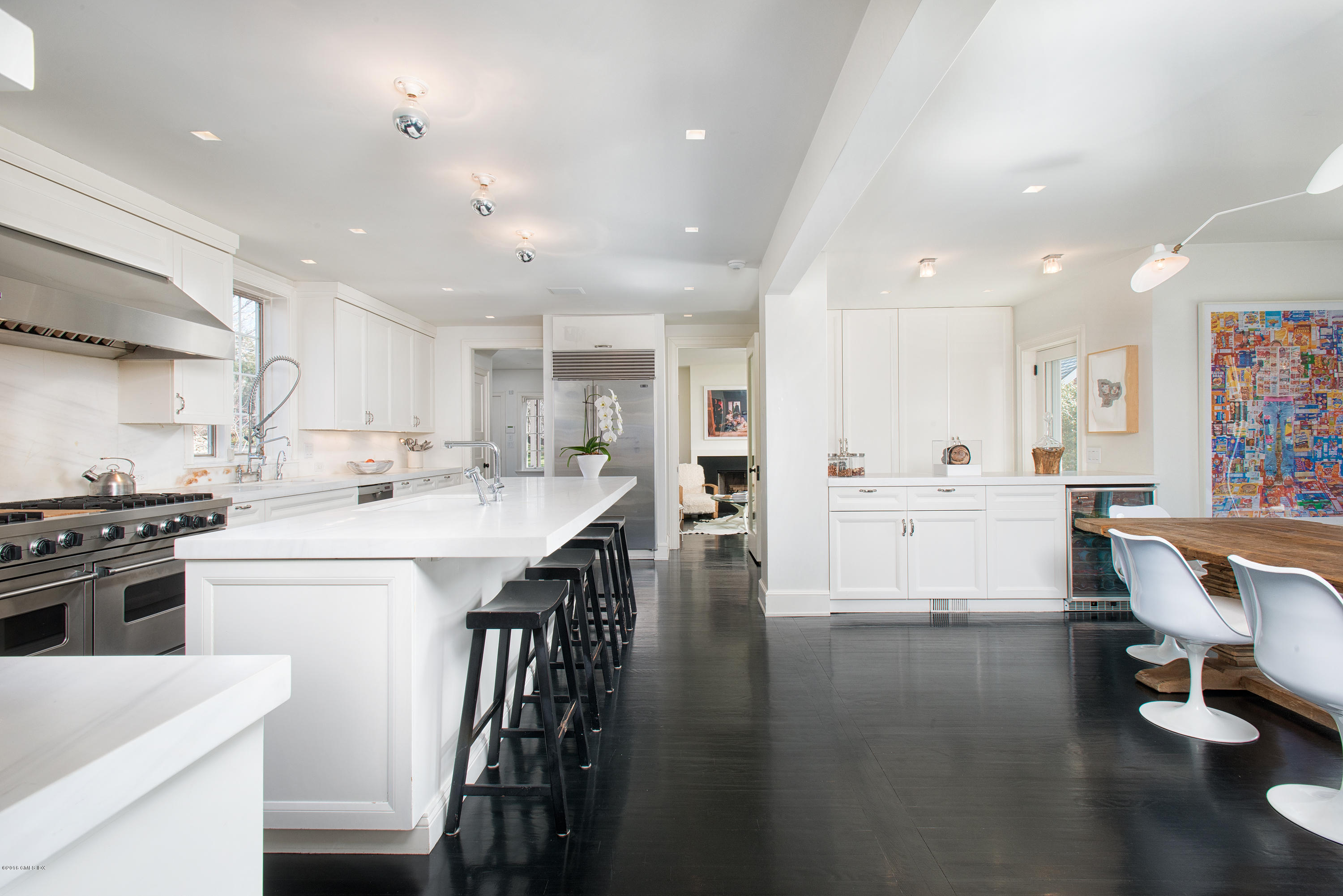 46 Quail Road Greenwich, CT 06831 - Photo 8 of 22 a kitchen with stainless steel appliances kitchen island granite countertop a stove a sink and a refrigerator