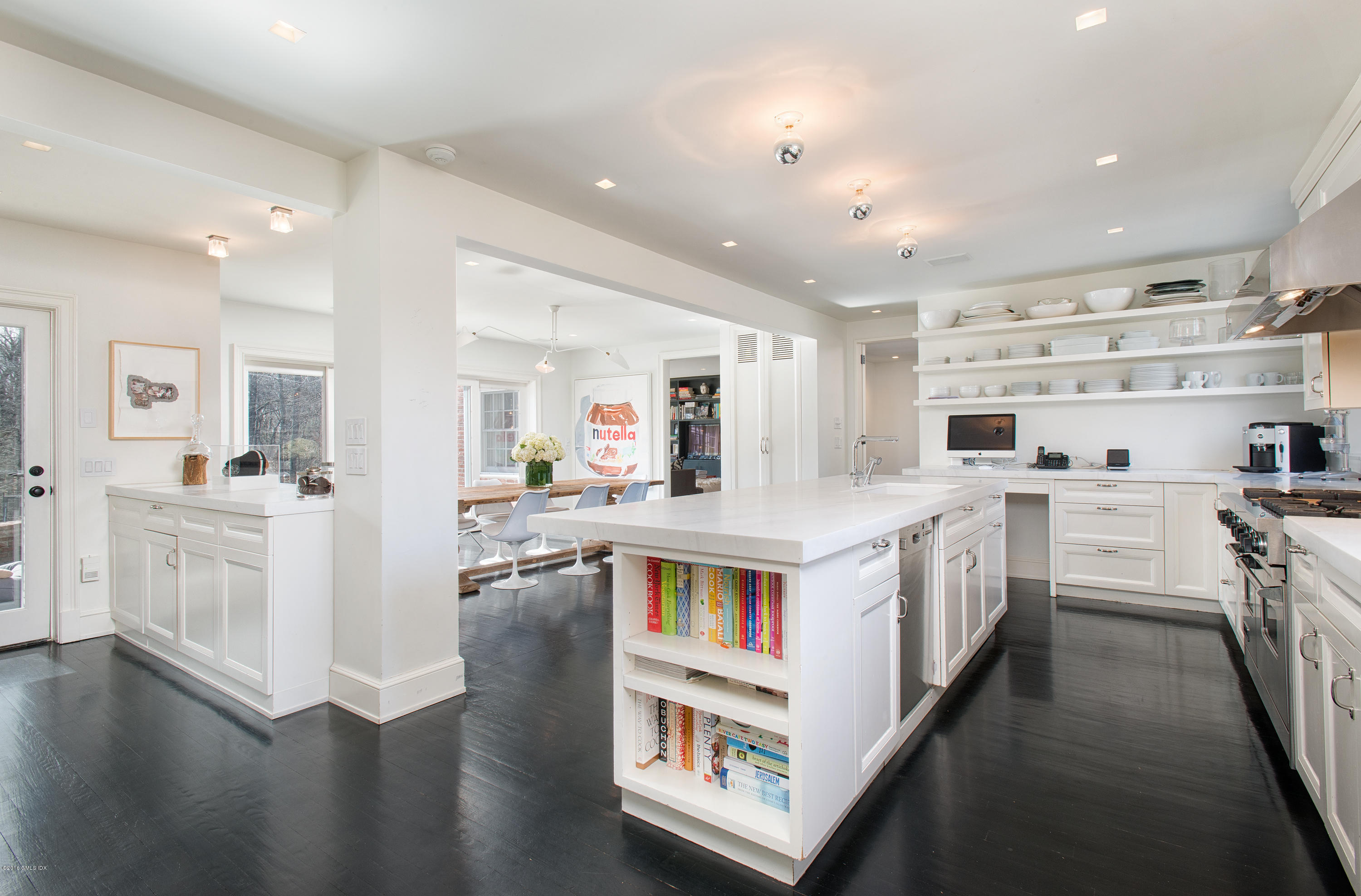 46 Quail Road Greenwich, CT 06831 - Photo 9 of 22 a kitchen with cabinets and wooden floor