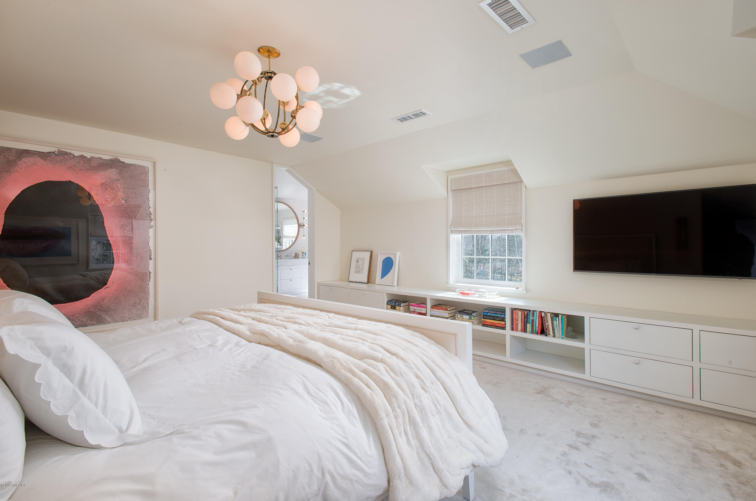 46 Quail Road Greenwich, CT 06831 - Photo 10 of 22 a bedroom with a bed and a flat screen tv