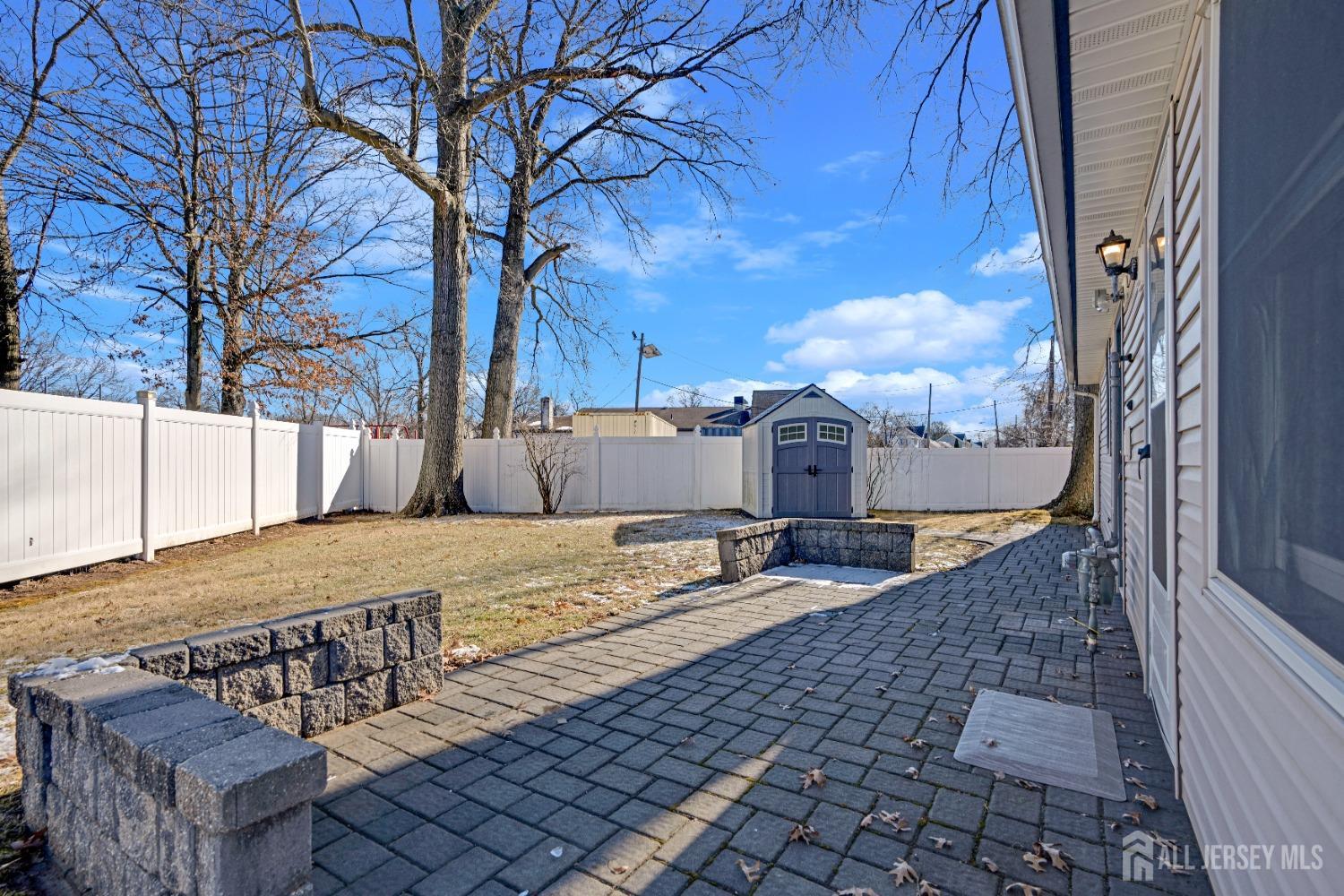 52 Markham Road Edison, NJ 08817 - Photo 26 of 28 a view of a backyard with a snow