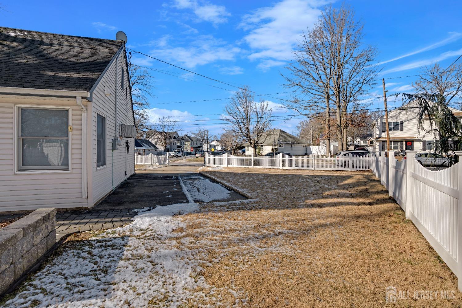 52 Markham Road Edison, NJ 08817 - Photo 27 of 28 a view of a yard and car parked