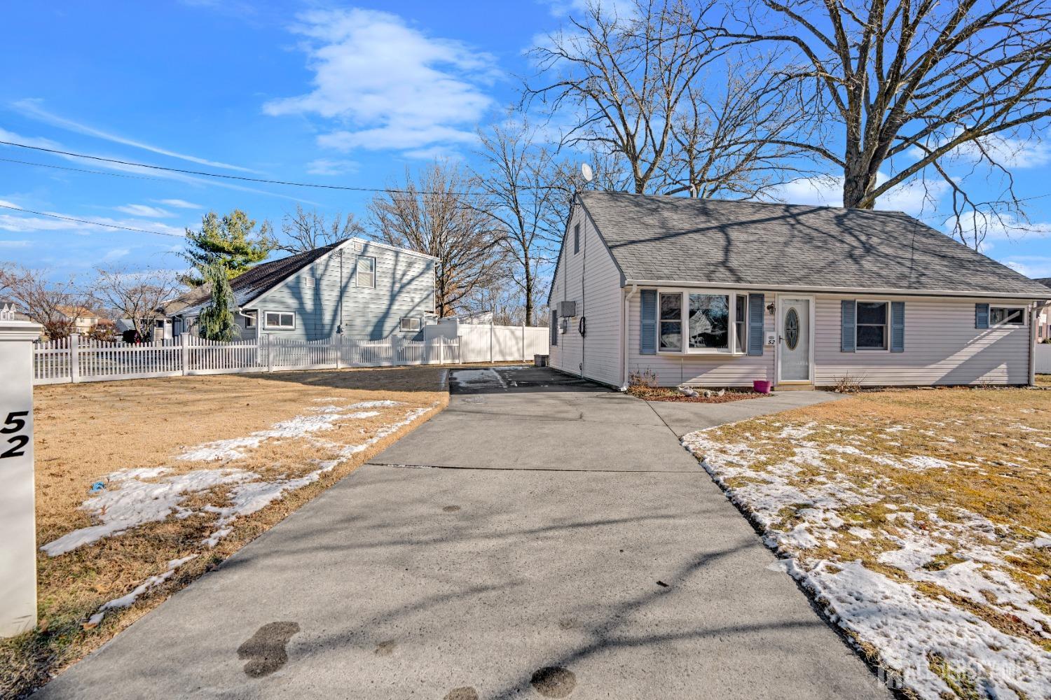 52 Markham Road Edison, NJ 08817 - Photo 4 of 28 a view of a house with snow on the road