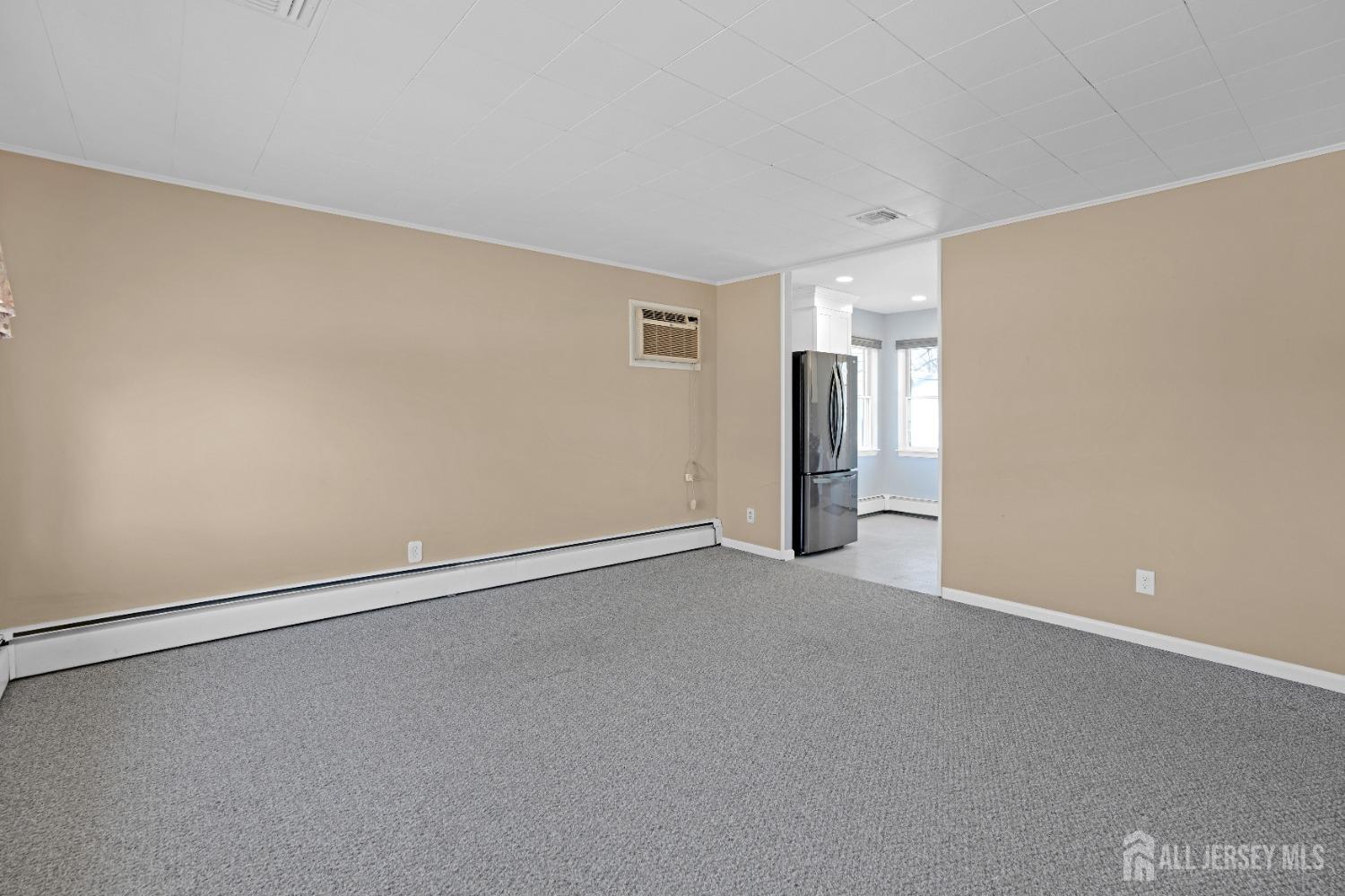 52 Markham Road Edison, NJ 08817 - Photo 5 of 28 a view of an empty room with a window