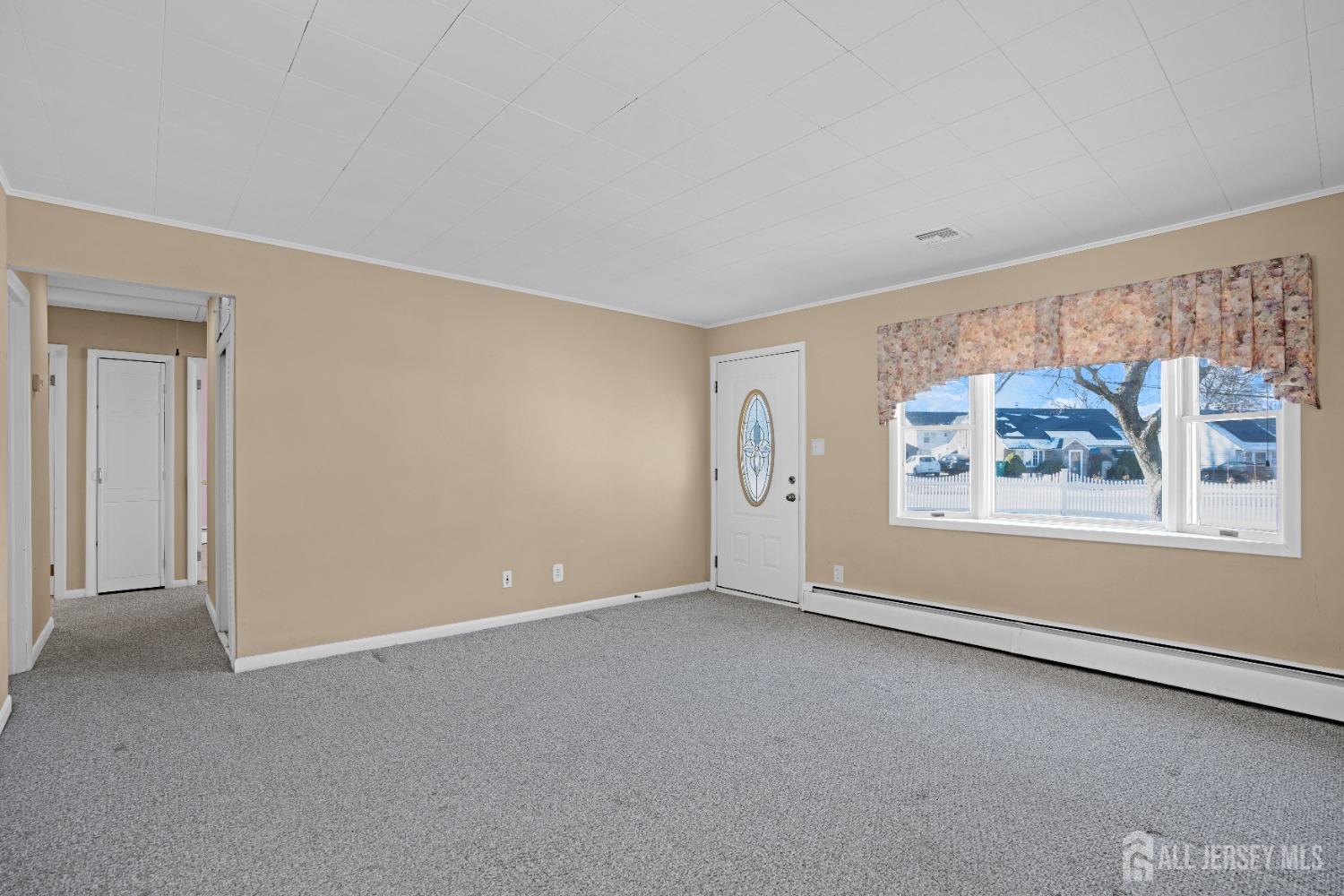 52 Markham Road Edison, NJ 08817 - Photo 6 of 28 a view of an empty room with a window