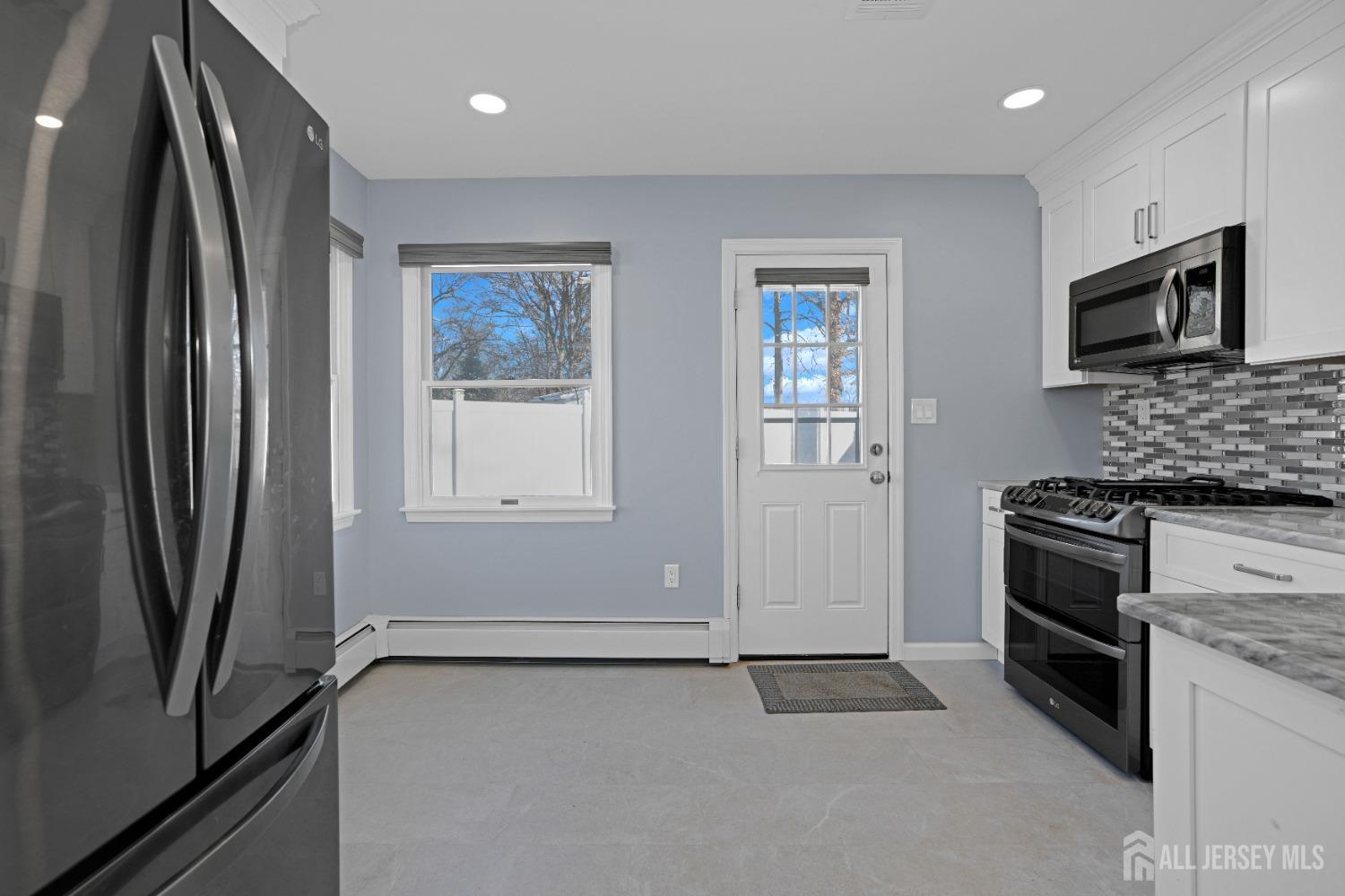 52 Markham Road Edison, NJ 08817 - Photo 8 of 28 a kitchen with stainless steel appliances granite countertop a refrigerator and a stove top oven