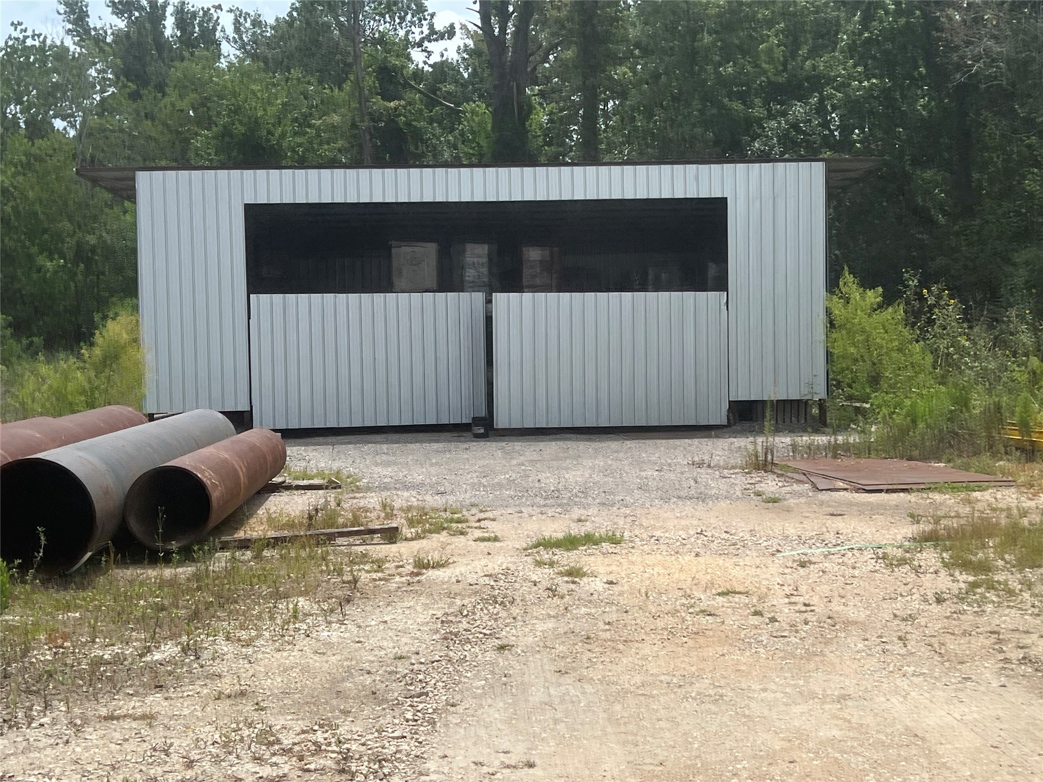 17302 Ramsey Road Crosby, TX 77532 - Photo 13 of 19 a backyard of a house with a bench and trees