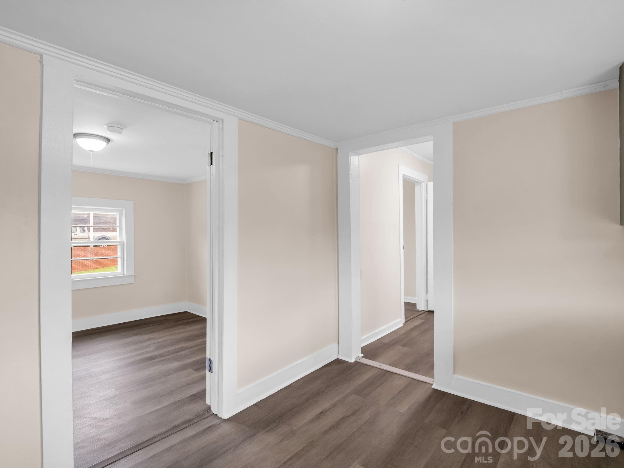 170 Dobbins Road Ellenboro, NC 28040 - Photo 28 of 32 an empty room with wooden floor and windows
