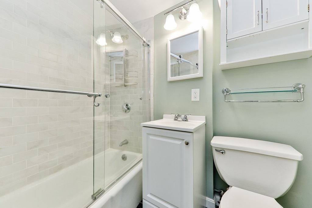 512-516 Green Street, Unit 1D Cambridge, MA 02139 - Photo 5 of 9 a bathroom with a toilet sink and shower