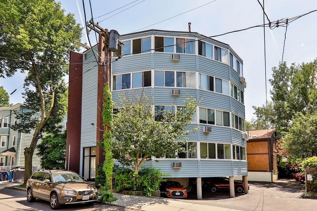 512-516 Green Street, Unit 1D Cambridge, MA 02139 - Photo 9 of 9 a car parked in front of a building