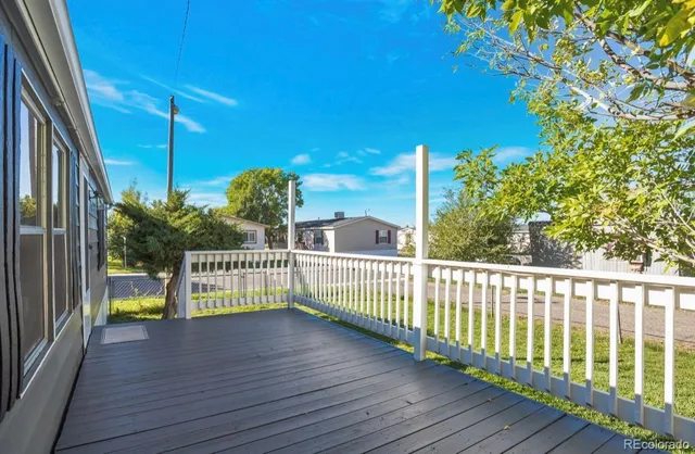 a view of outdoor space with deck and flat screen tv
